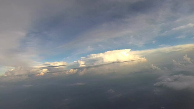 Skydiving. A jump out of a plane and flying in the sky above clouds.
