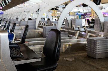 Row of empty check-in counter in airport due to pandemic of covid-19