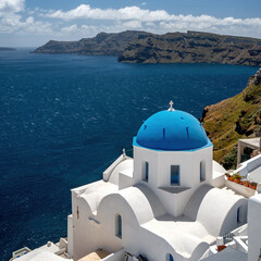 Fototapeta na wymiar Santorini blue domed church overlooking the Mediterranean Aegean Sea and caldera on a sunny blue sky day