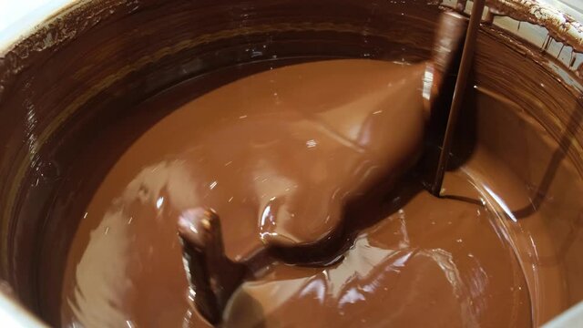 Chocolate tempering machine in the process of mixing ganache.