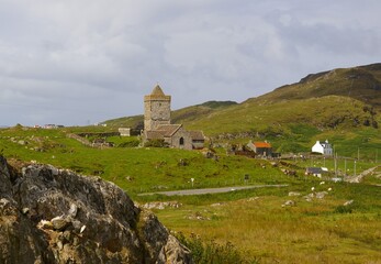 Fototapeta na wymiar The local church and village at Rodel on the Isle of Harris in the Western Isles of Scotland.