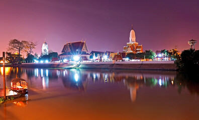 Phutthaisawan temple at night time with reflection on river view from river side in Thailand