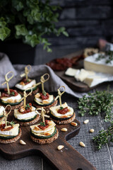 Zucchini sandwiches with soft cheese and sun dried tomatoes 