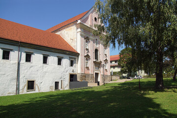 Fototapeta na wymiar Dominican monastery established in the 13th century by the Dominican Order next to the Drava river and a castle in Ptuj. Slovenia. September 10, 2019: 