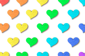 rainbow wooden heart pattern with shadow on white background