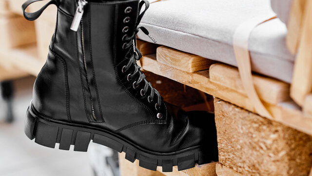 women's shoes on a stand on wooden platform
