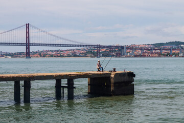 Daily life in one of the most popular neighborhood in Lisbon, Almada. Is over the river and is like a little village. There are restaurants, people, and is full of colors and life in Portugal