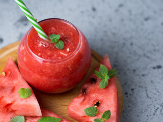Seasonal refreshing Watermelon smoothie in a glass on the table