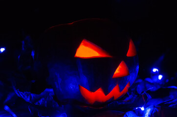 Glowing pumpkin in the dark close-up. concept of the Halloween, background.