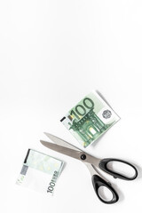 Decline of euro exchange rate. Scissors cut dollars banknote