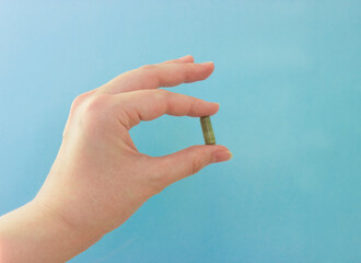 Chlorella in capsules super food. vegetable dietary Supplement Chlorella.capsule in hand