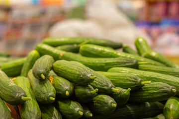 Green fresh cucumbers in the store.