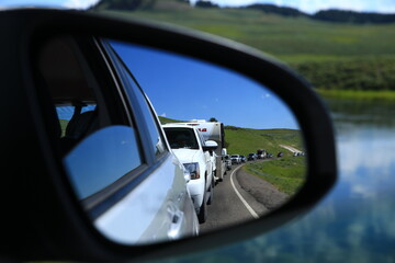 watching A car queue through rearview mirror