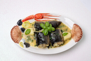 Fish dish on table. Close-up of freshly cooked pieces of European eel fish served on a porcelain plate with a creamy dill sauce and potatoes on a light pink glitter sparkle background. Concept health.