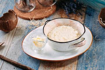 Obraz na płótnie Canvas Healthy breakfast rice porridge with milk butter 