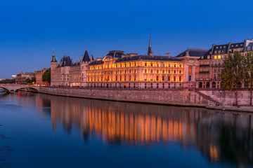 Paris, France - June 20, 2020: Pont Neuf at blue hour with reflection in Seine river in Paris