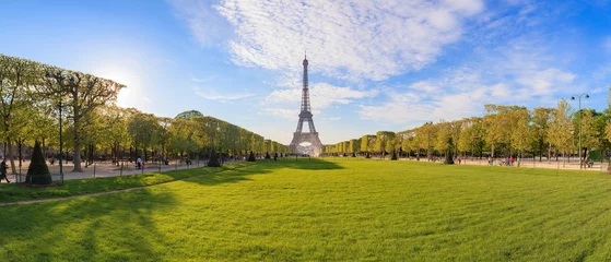 Wall murals Paris Panorama of the Champ de Mars park in Paris overlooking the Eiffel Tower photographed in the evening light in September 2016