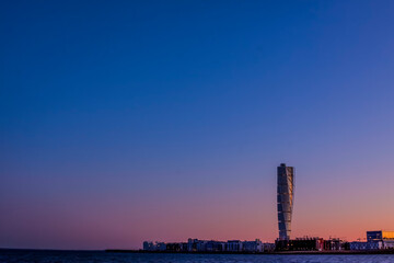 Naklejka premium The skyscraper, Turning torso, in Malmo Sweden, the largest building in Scandinavia, in sunset