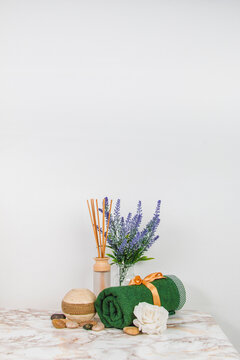 Spa objects and elements on a marble table and white background