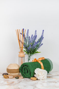 Spa objects and elements on a marble table and white background