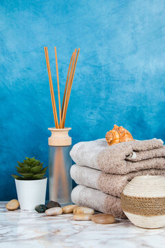 Spa objects and elements on a marble table and blue background