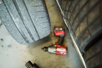 Detail of a disassembled racing tire in a service box.