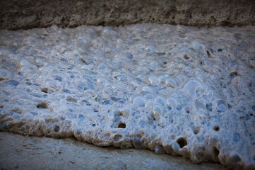 Flotation foam. Ore concentration by stirring on gold mining and processing plant. Altynalmas...