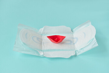 Feminine sanitary pad on a light background. Gynecology. PMS