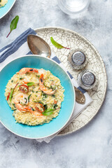 Orzo pasta with king shrimp, sun-dried tomatoes and spinach