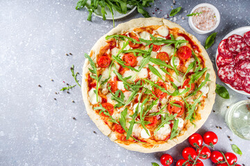 homemade pizza with fresh arugula