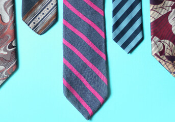 Parts of neckties on the blue background