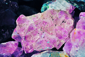 raw large purple amethyst stone in a cave with dirty spot