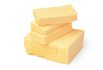 Block of butter isolated on white background