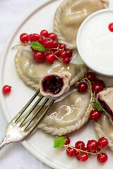Polish traditional ravioli with cherries 