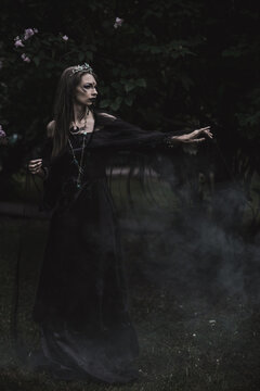 girl in a gothic gloomy image in a lilac