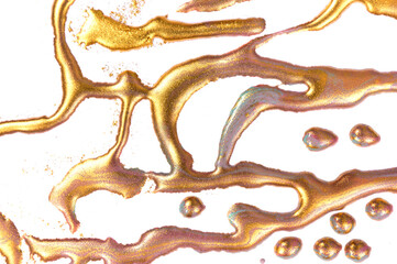 Gold stains on white paper background.