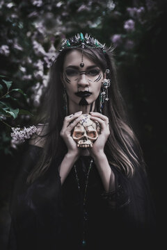 girl in a gothic gloomy image in a lilac