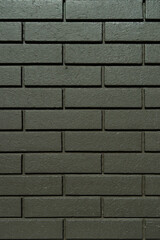 モスグリーン色のレンガ壁