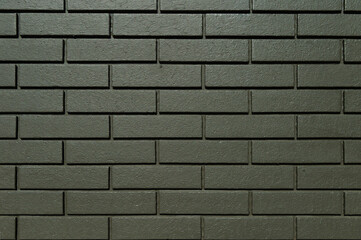 モスグリーン色のレンガ壁