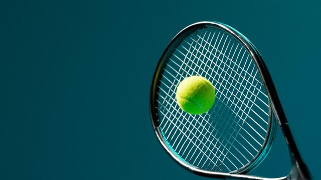 Slow-motion animation of the tennis racket striking the ball. A ball hit. 4 K HD