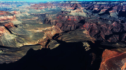 Aerial view of Grand Canyon environment with high mountains peaks, beautiful landscape sandstone formation in famous American landmark in National Park ofArizona