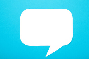 White paper speech bubbles on blue background