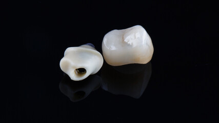 dental ceramic crown and zercon abutment in modern dentistry, shot on a black background