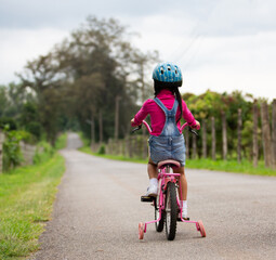 little girl riding a bike