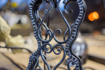 Blacksmith decorative elements at forge, workshop. Handmade, craftsmanship and blacksmithing concept
