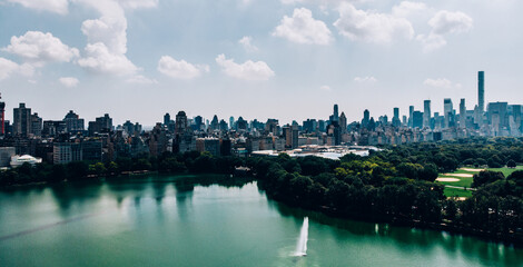 Aerial view from helicopter sightseeing tour around Central Park and Manhattan downtown. Scenery view of eco architecture in big New York megapolis. Preservation of nature and care of environment