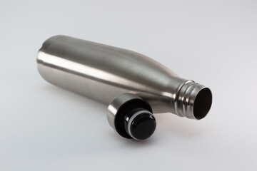 Metal flask, bottle for preservation of a hot or cold liquid on a white background.