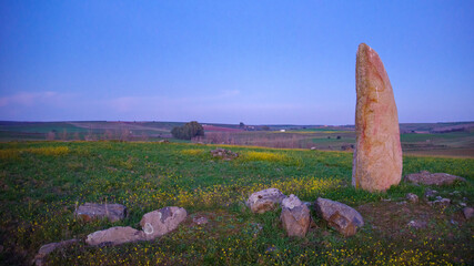 menhir in spain at the fall of the sun