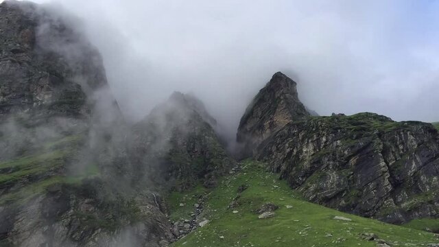 Clouds moving through the rocky mountains of Himachal Pradesh in India - time lapse