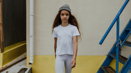 Girl kid wearing white blank t-shirt. Mock up for print.